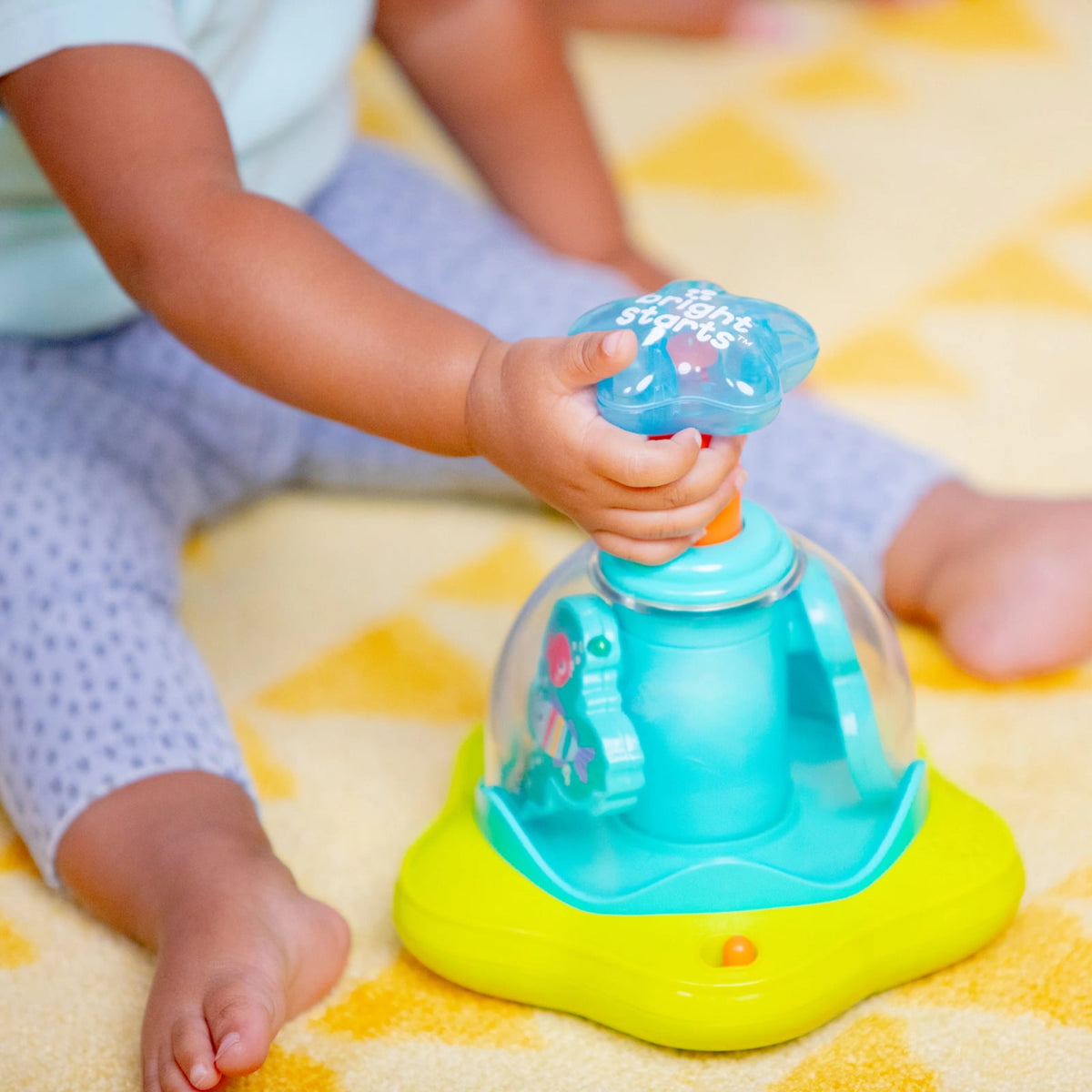 Bright Starts Press Glow Spinner muzikaal speeltje 6m+
