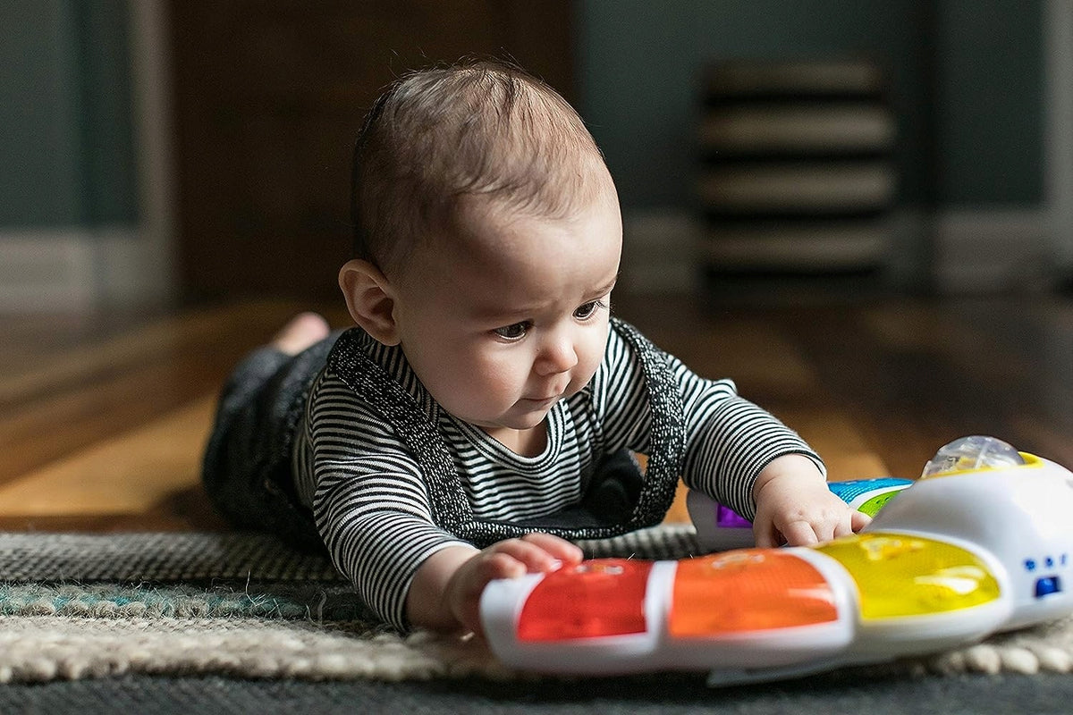 BABY EINSTEIN panneau lumineux avec hochet, mélodies et mots en 3 langues