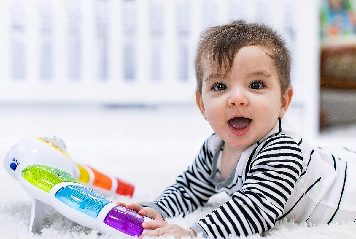 BABY EINSTEIN panneau lumineux avec hochet, mélodies et mots en 3 langues