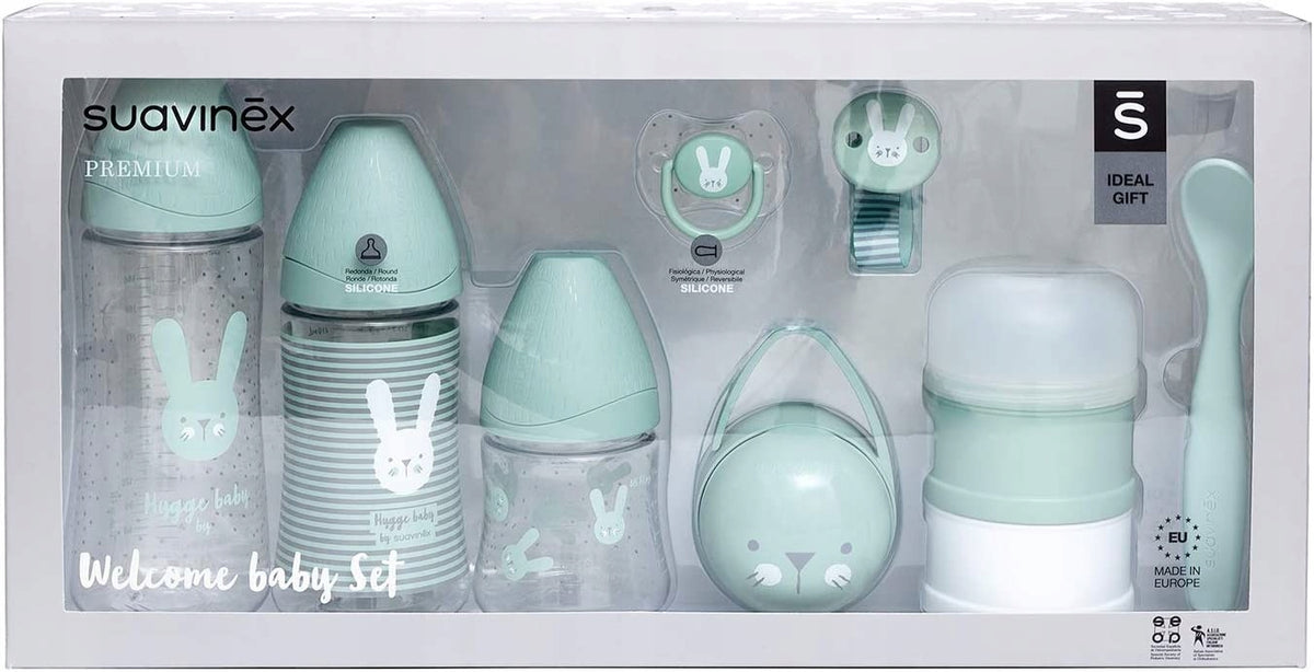 SUAVINEX Welcome Baby zestaw startowy PREMIUM z smoczkiem, klipsem, pojemnikiem na mleko i łyżeczką